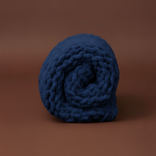Blue knitted fabric roll on a brown background